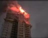 СТРАВ И УЖАС ВО ТЕКОТ НА НОЌТА: Гори зграда од 28 ката, запалени делови паѓале на тротоар и улица (ФОТО/ВИДЕО)